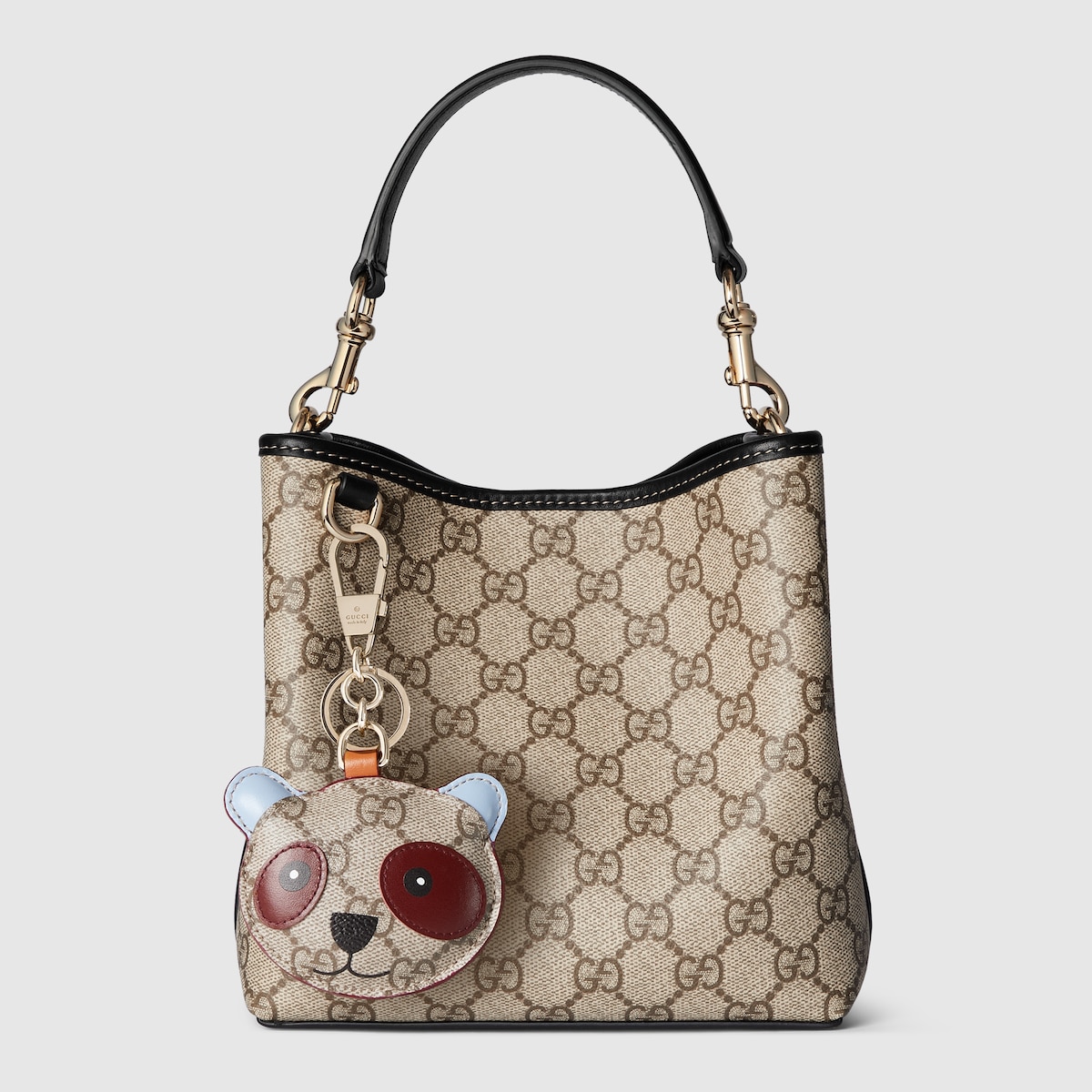 GG Emblem small bucket bag in beige and dark brown fabric