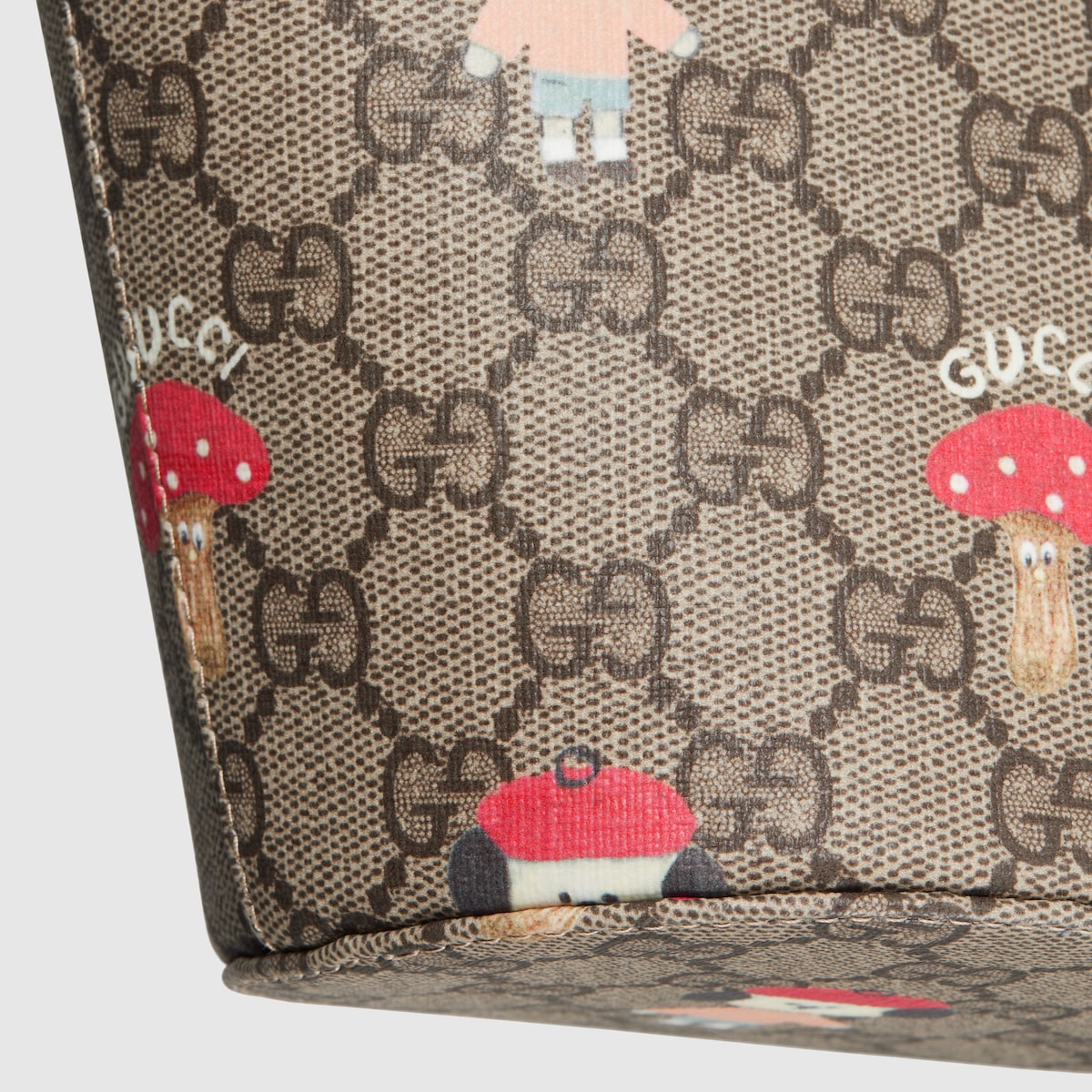 Children's printed GG bucket bag in beige and dark brown