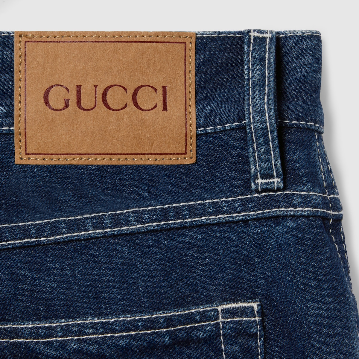 Slim cropped fit lasered denim pants in blue | GUCCI® US