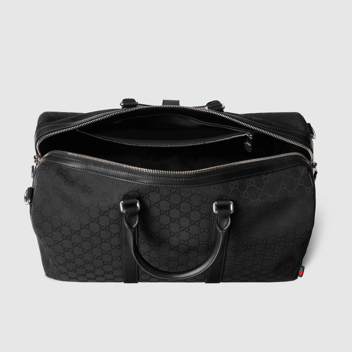 GG canvas medium duffle bag in black GG canvas | GUCCI® FR