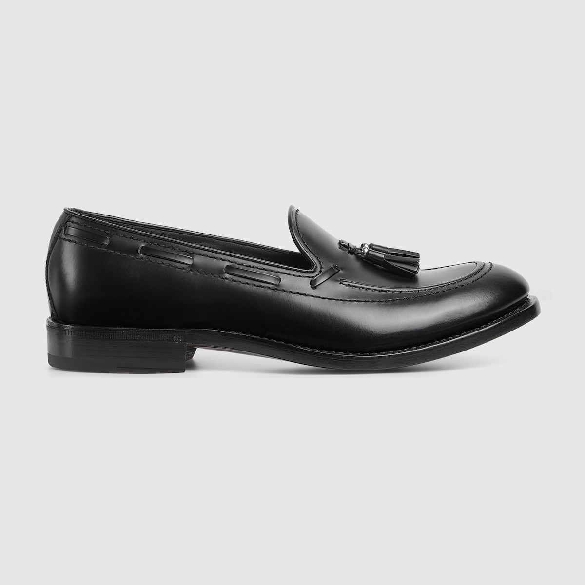 Men's loafer with tassel detail in black leather | GUCCI® US