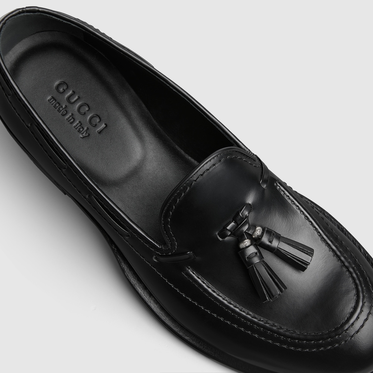 Men's loafer with tassel detail in black leather | GUCCI® US