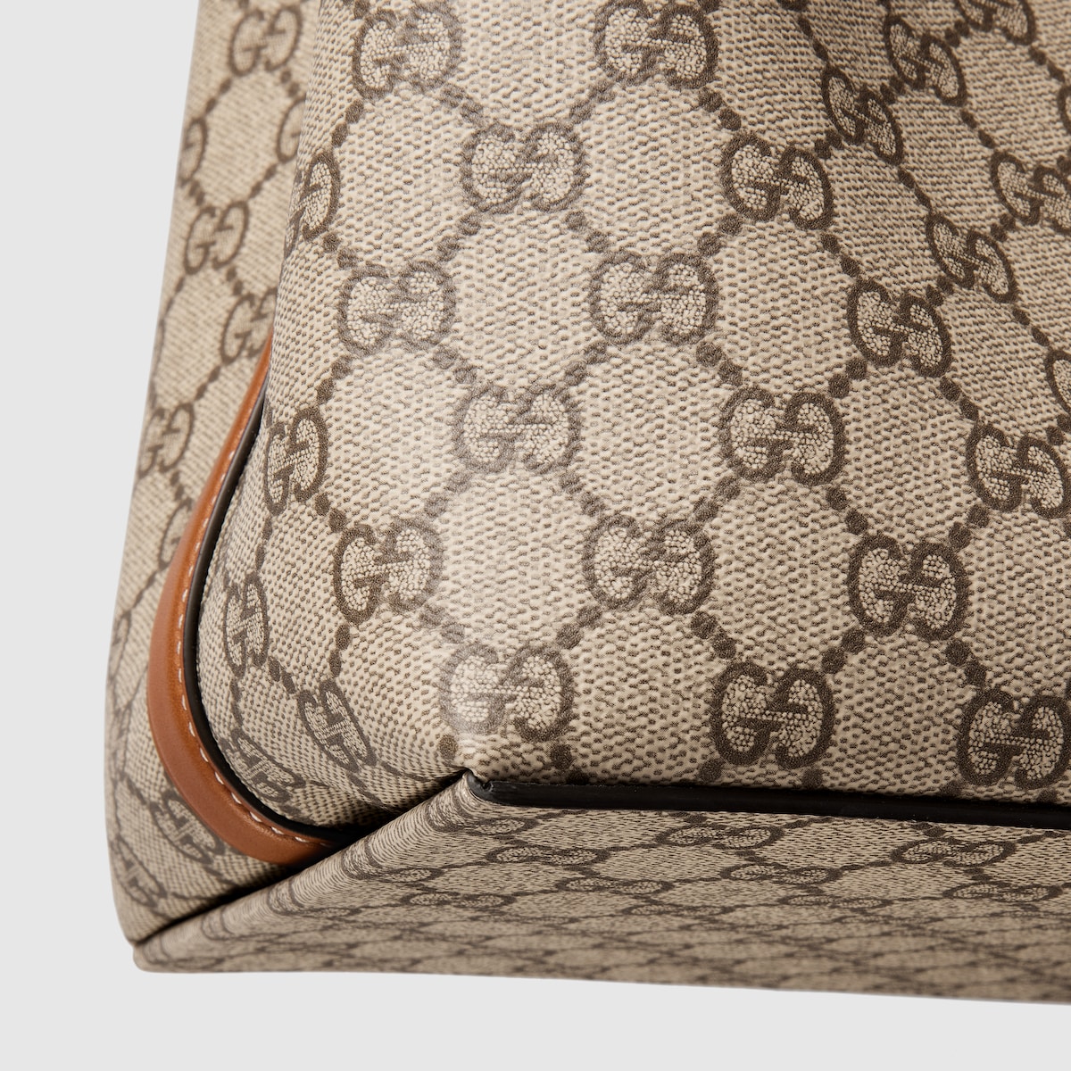 GG Emblem medium bucket bag in beige and brown GG fabric