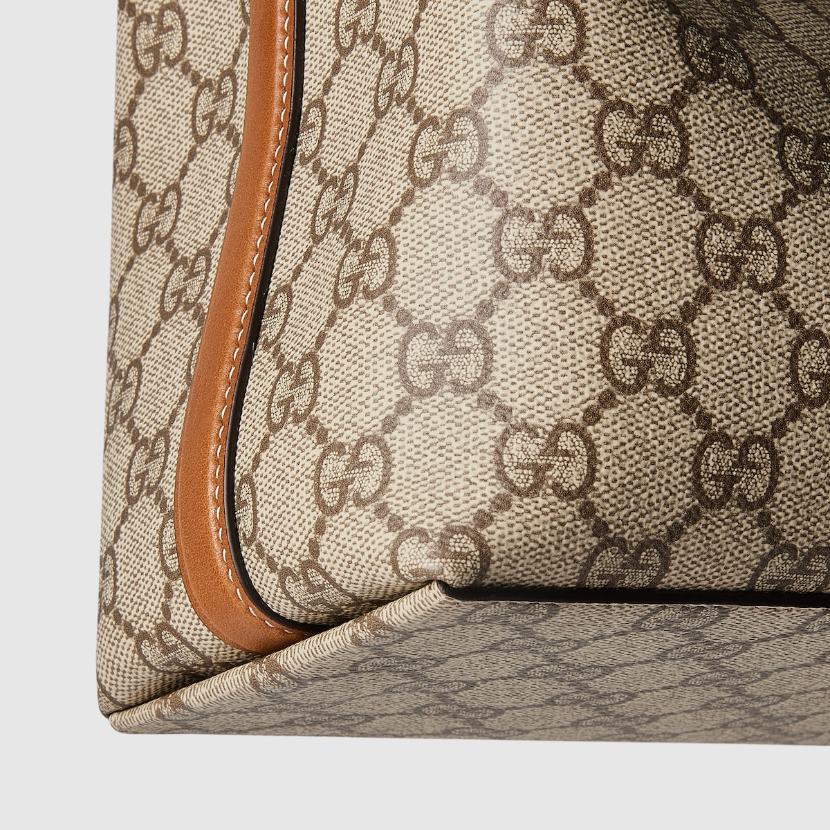 GG Emblem small bucket bag in beige and brown GG fabric