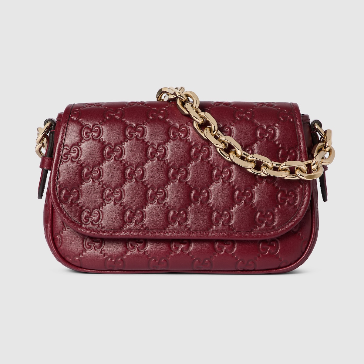 GG Emblem small shoulder bag in Rosso Ancora red GG leather