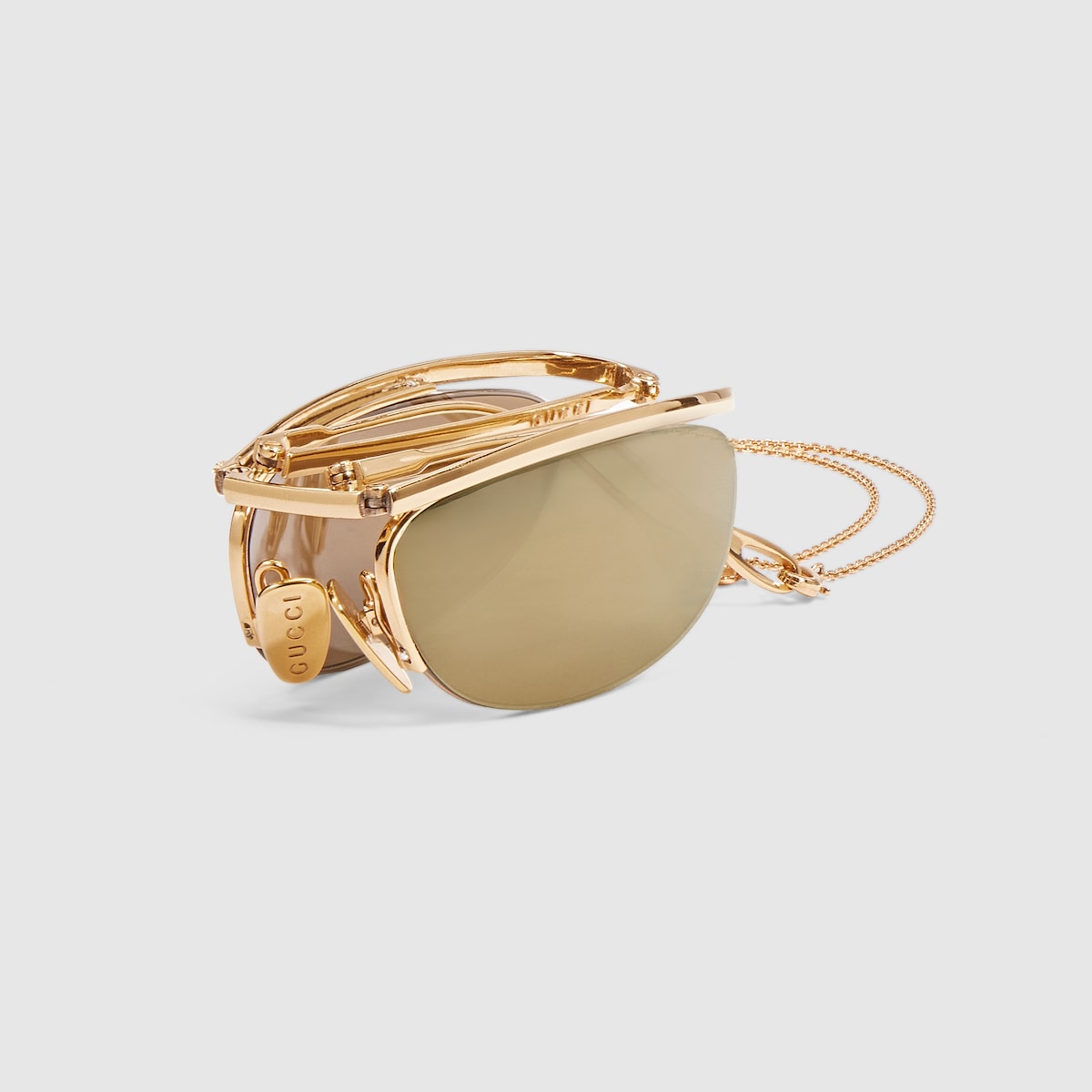 Foldable oval-shaped sunglasses in gold-toned | GUCCI® US