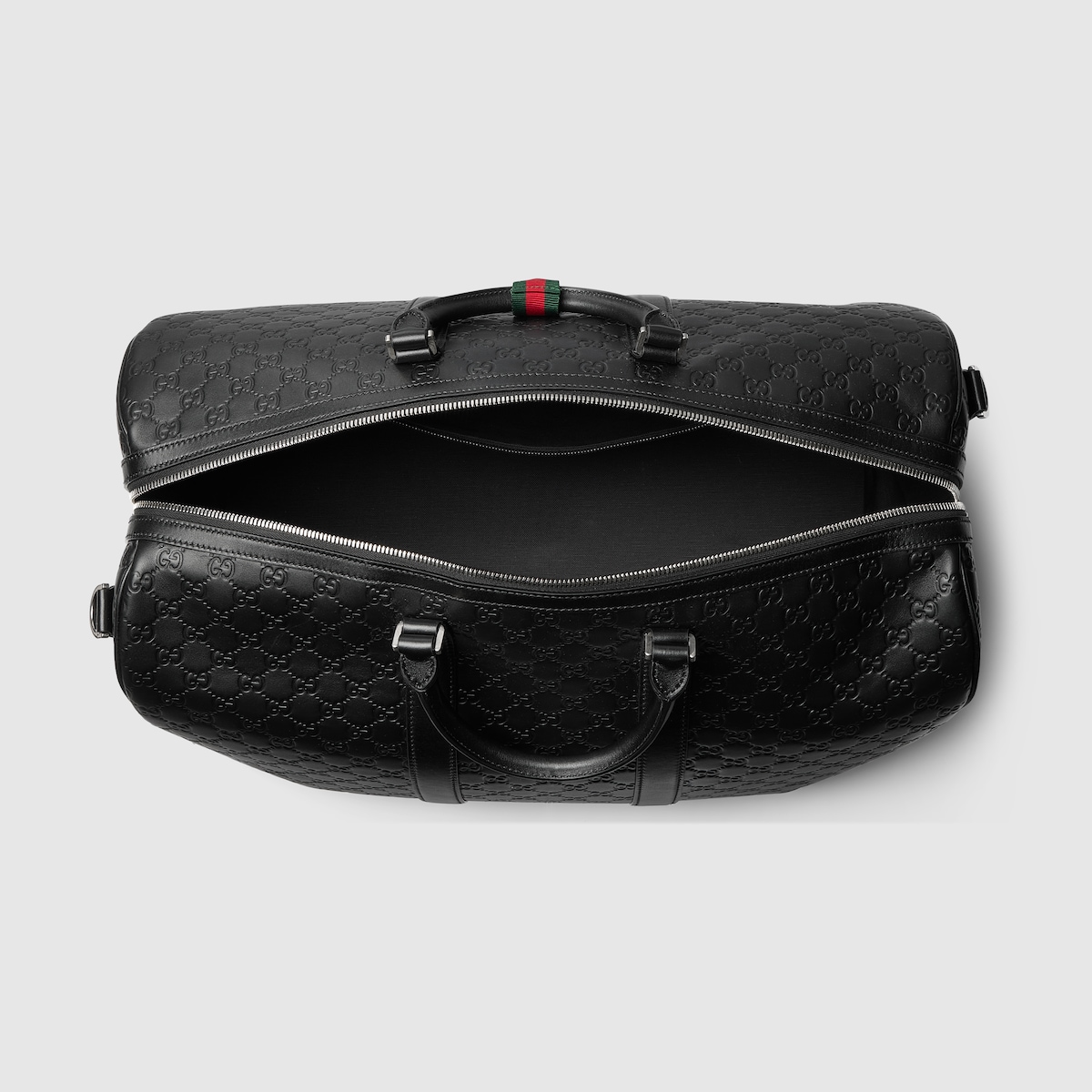 GG Emblem large duffle bag in black GG leather | GUCCI® US