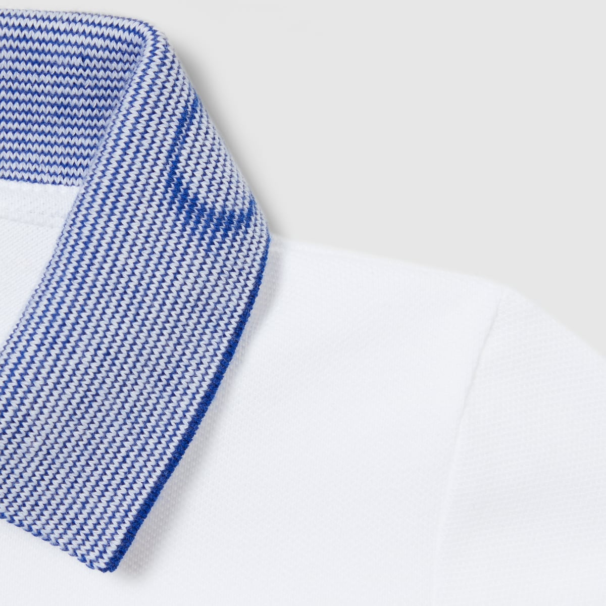 Baby cotton polo shirt with embroidery in white