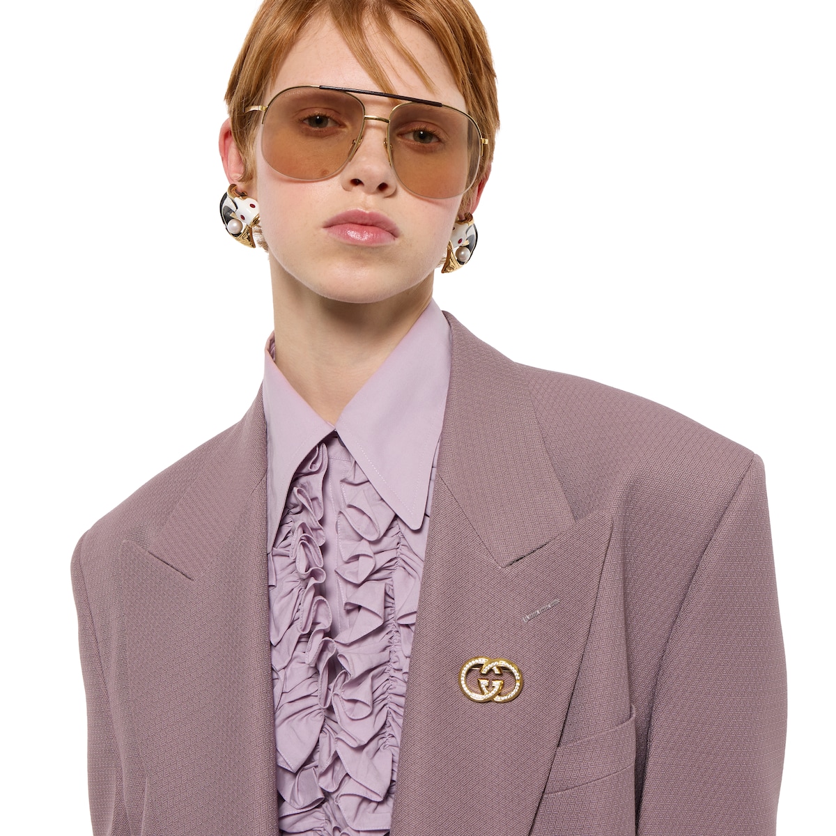 Gucci Interlocking crystal brooch in gold-toned brass