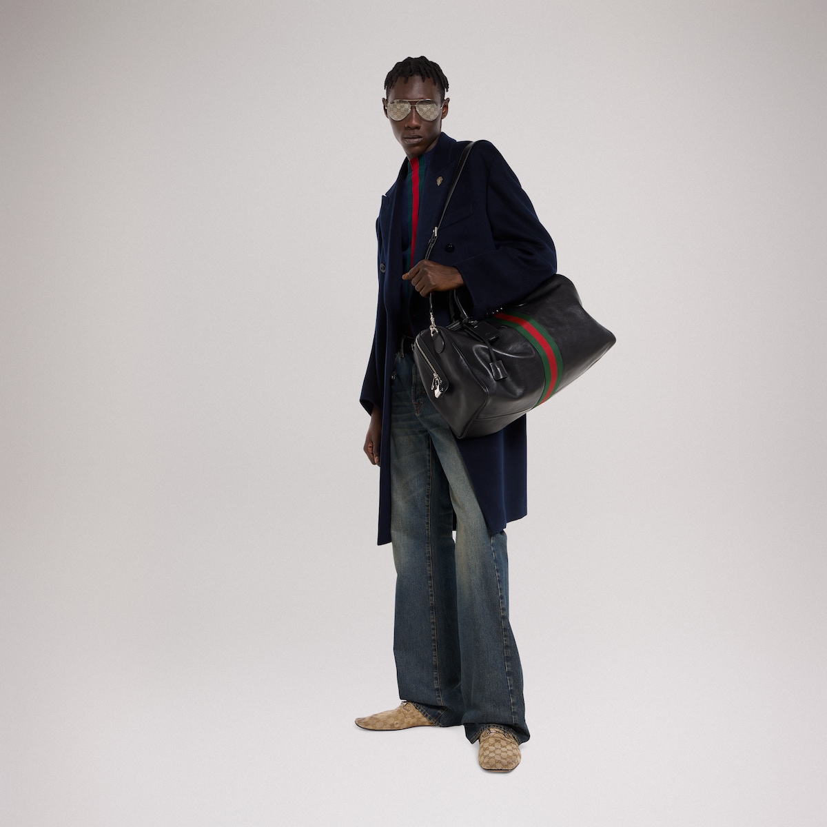Web Trademark medium duffle bag in black leather