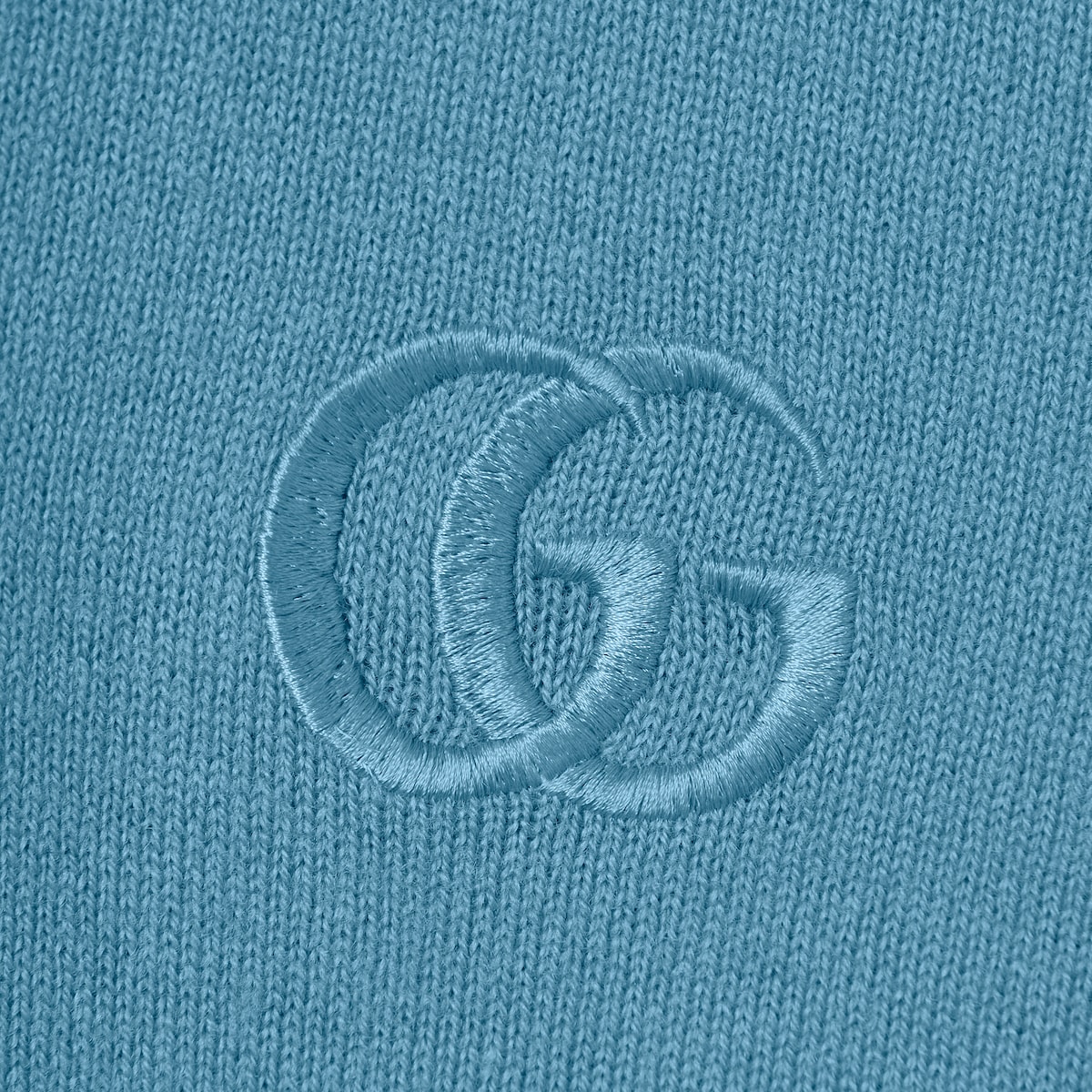 Knit wool polo shirt with embroidery in light blue