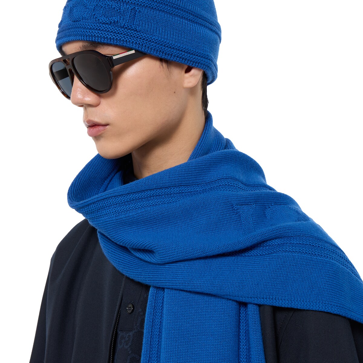 Knit wool scarf with Gucci logo in blue