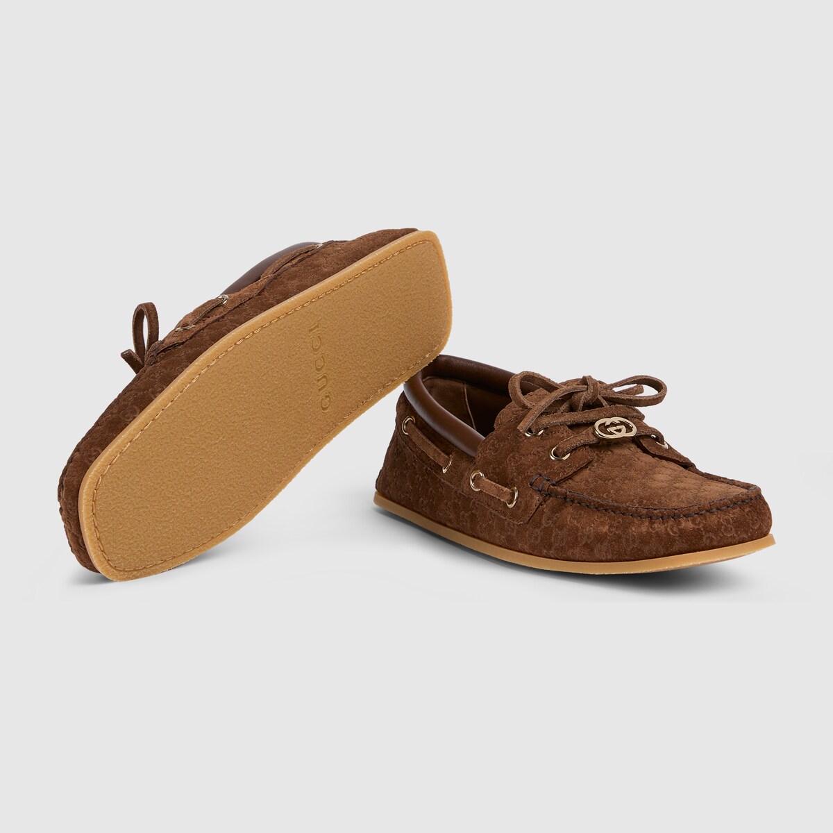 Women's boat shoe in dark brown GG suede