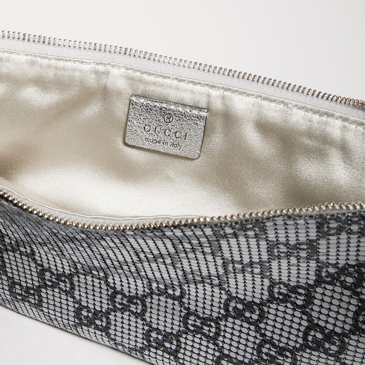 Metallic evening bag with charm in silver and black GG mesh