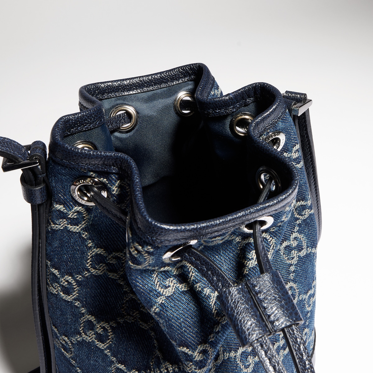 Mini bucket bag with Gucci plaque in dark blue GG denim GUCCI® UK