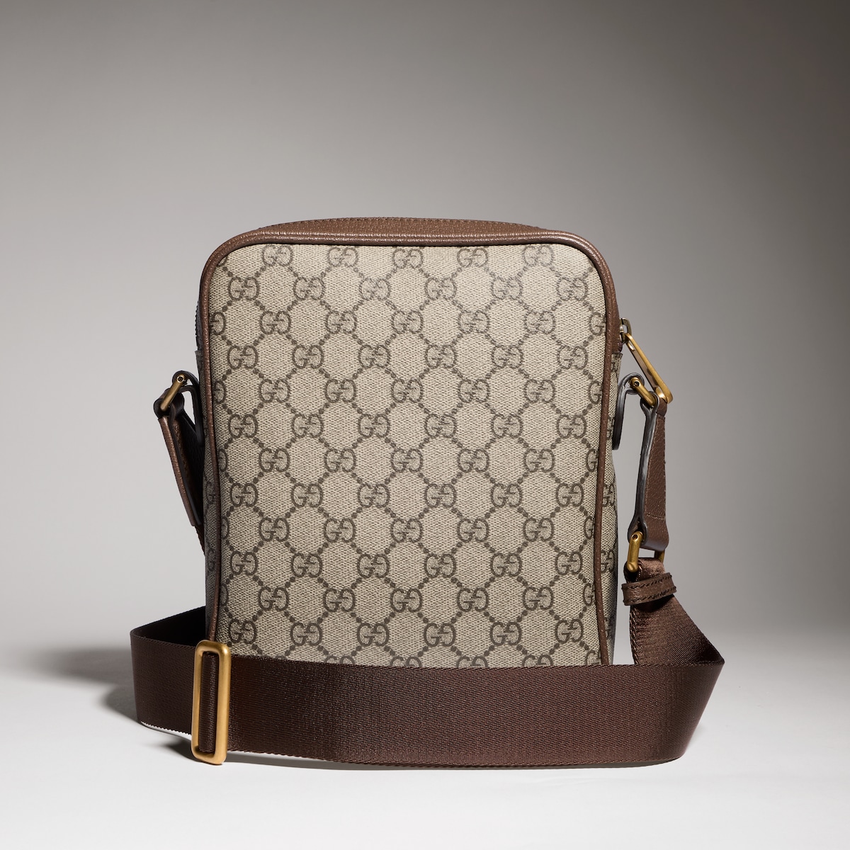 Ophidia small slingbag in beige and dark brown fabric