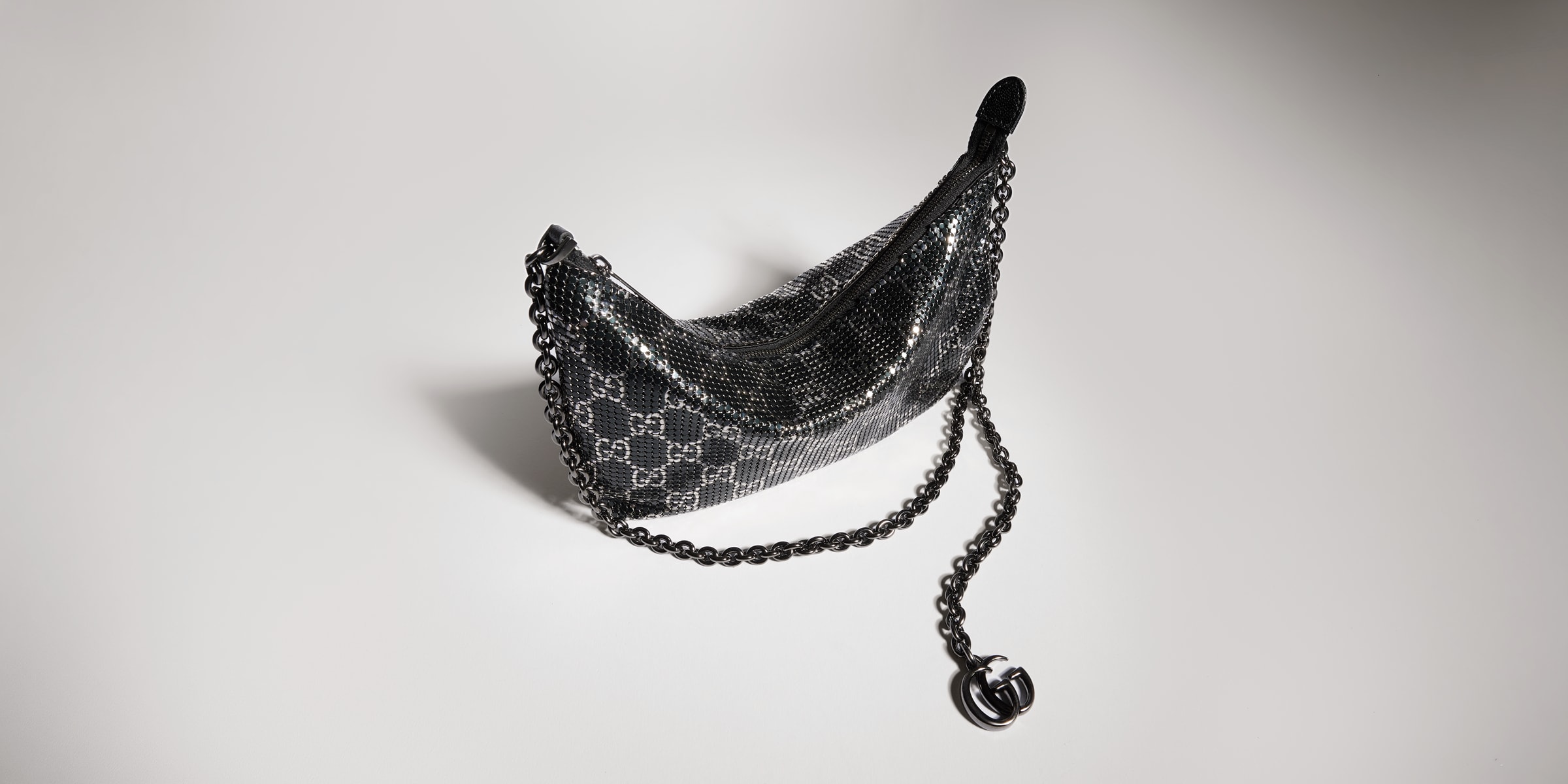 Metallic evening bag with charm