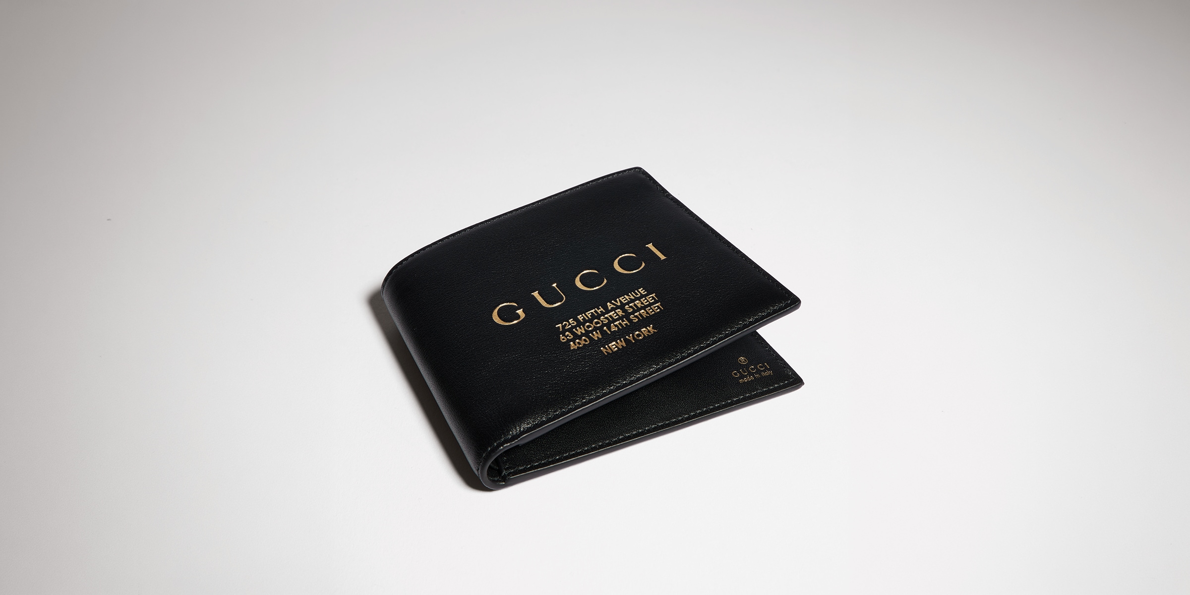 Bi-fold wallet with gold-foiled logo