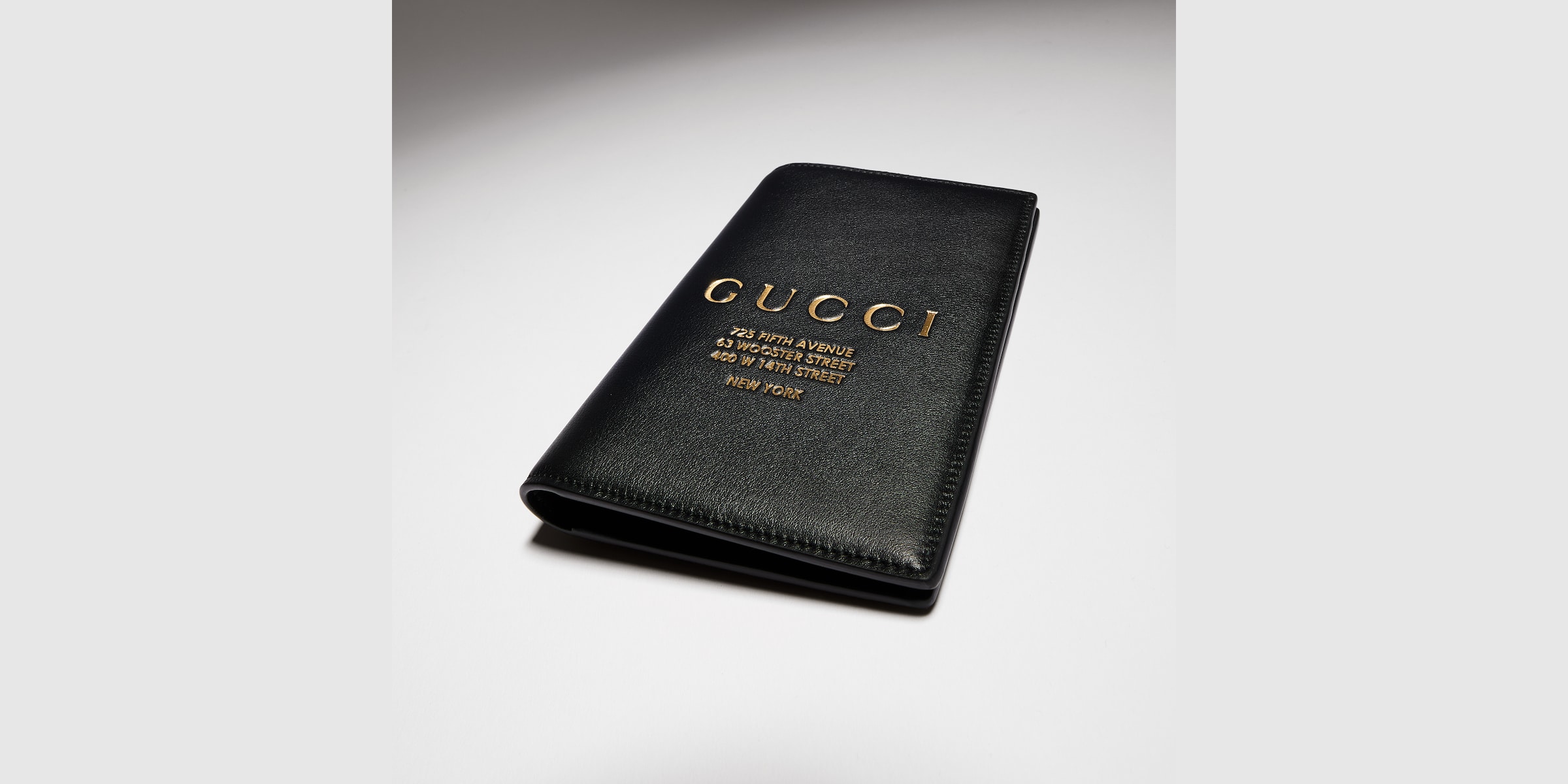 Passport case with gold-foiled logo