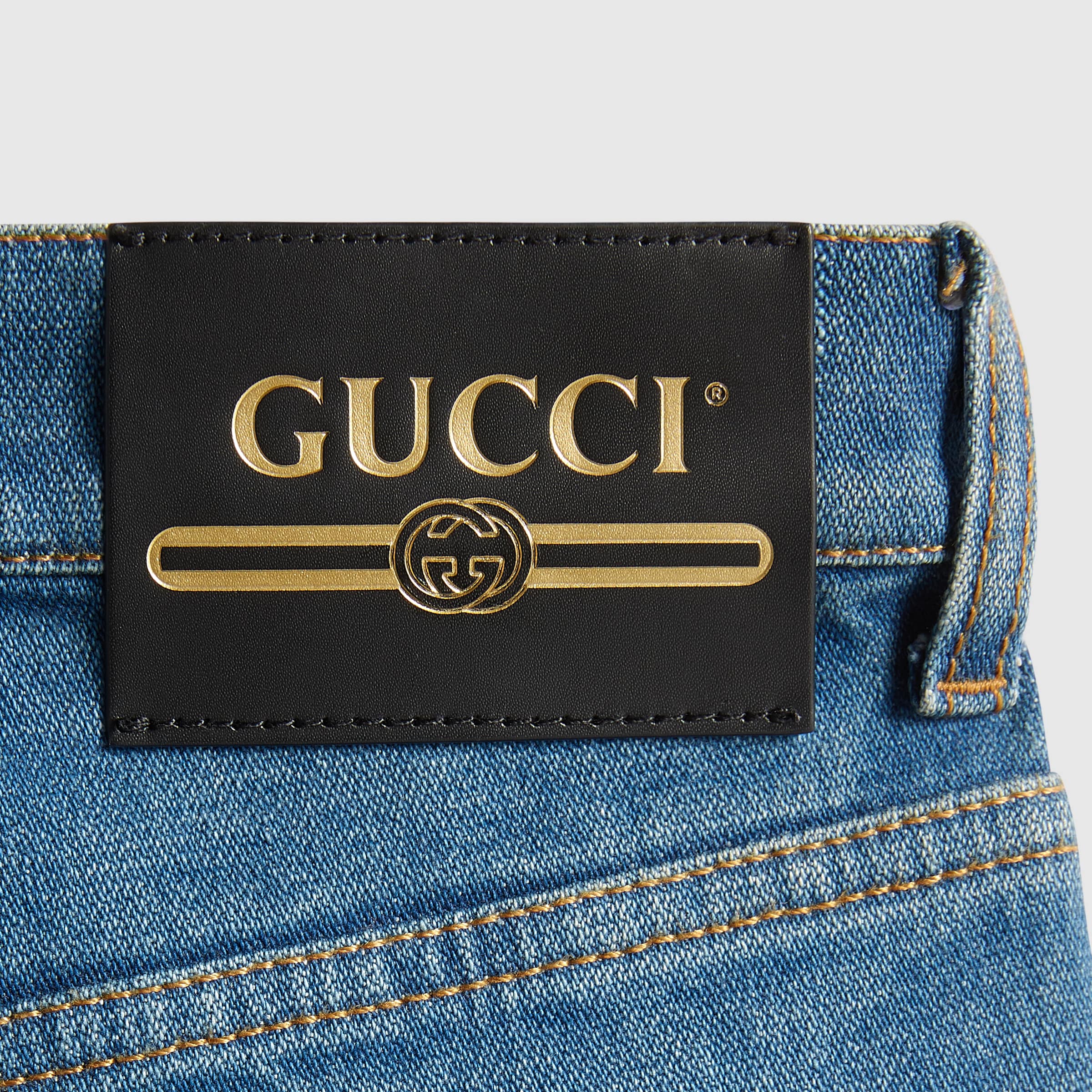 623441_XDA6N_4759_008_100_0000_Light-Washed-denim-flare-trousers-with-Gucci-label.jpg