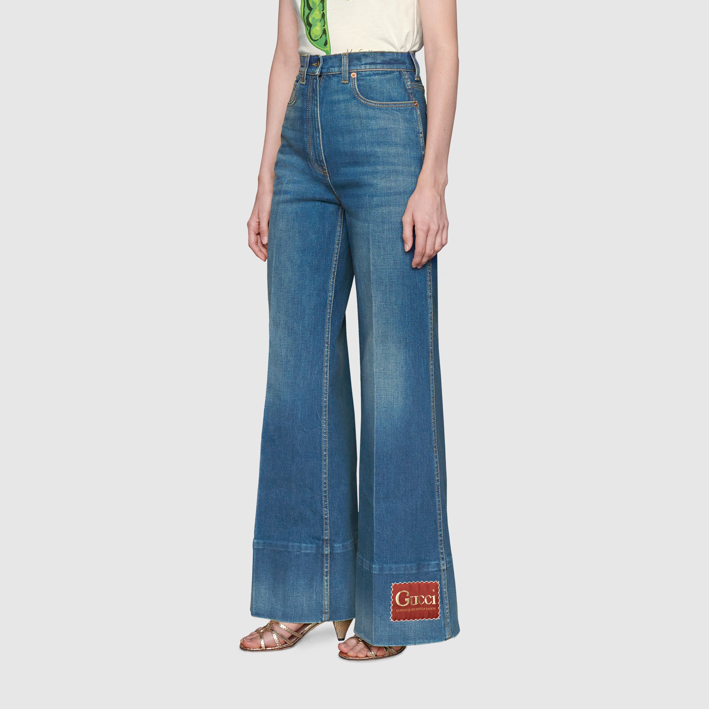 623441_XDA6N_4759_005_100_0000_Light-Washed-denim-flare-trousers-with-Gucci-label.jpg