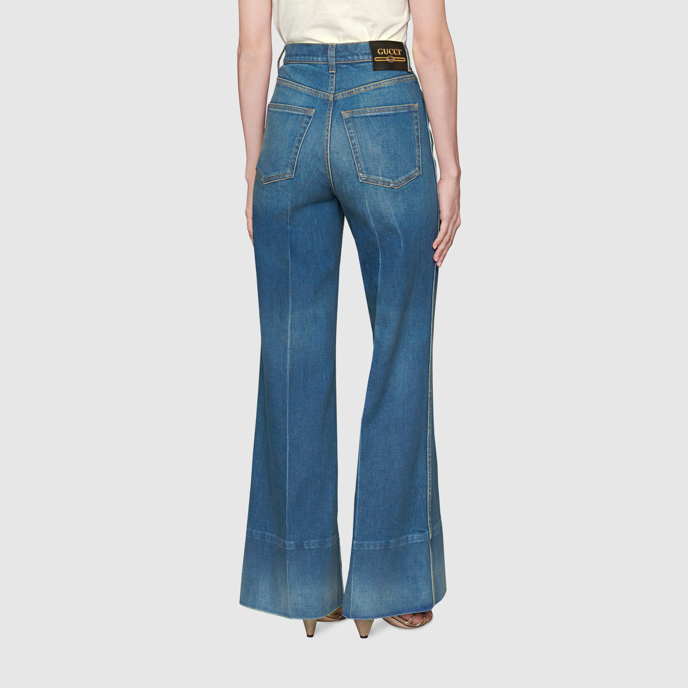 623441_XDA6N_4759_006_100_0000_Light-Washed-denim-flare-trousers-with-Gucci-label.jpg