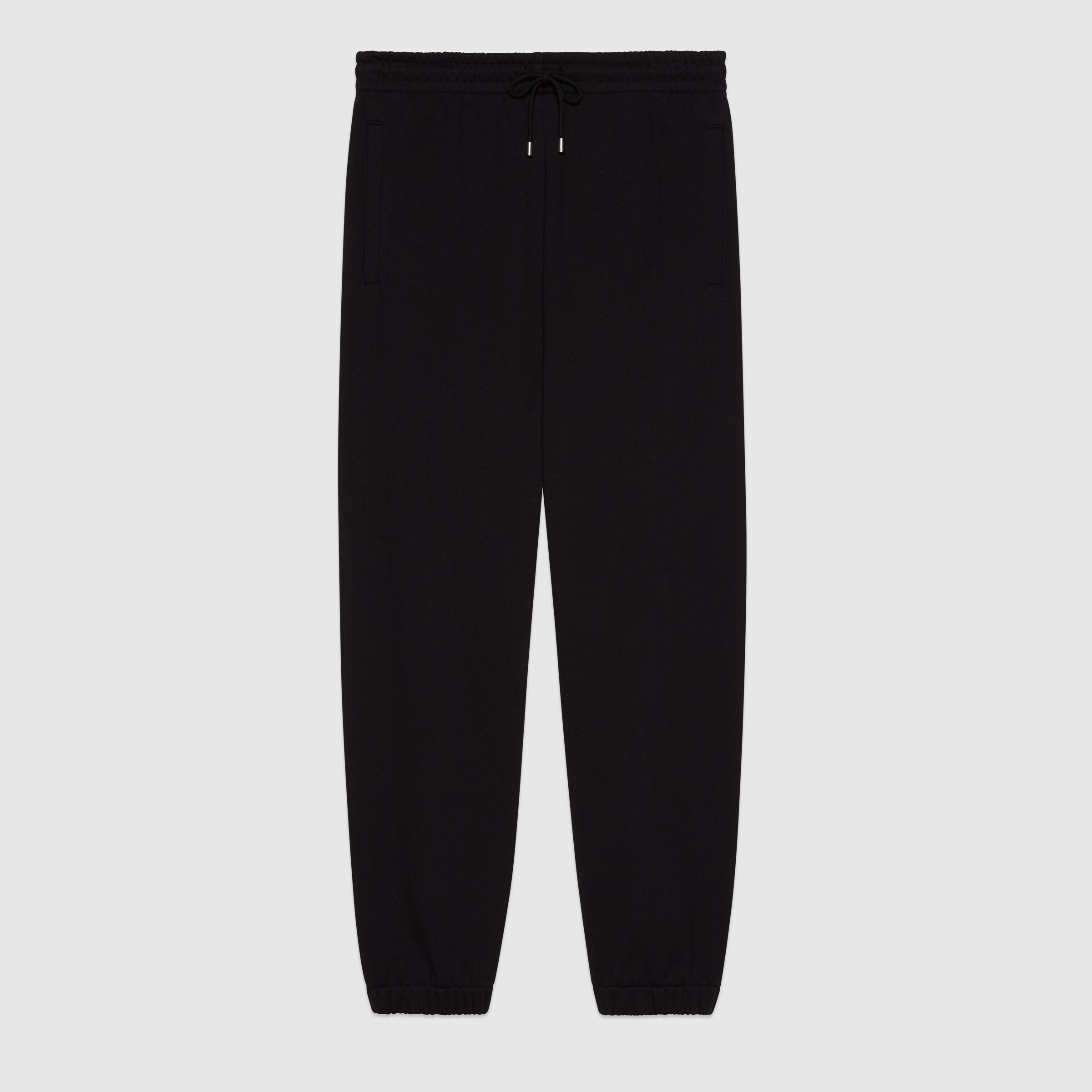 681145_XJDV3_1152_001_100_0000_Light-Jersey-track-bottoms-with-Gucci-mirror-print.jpg