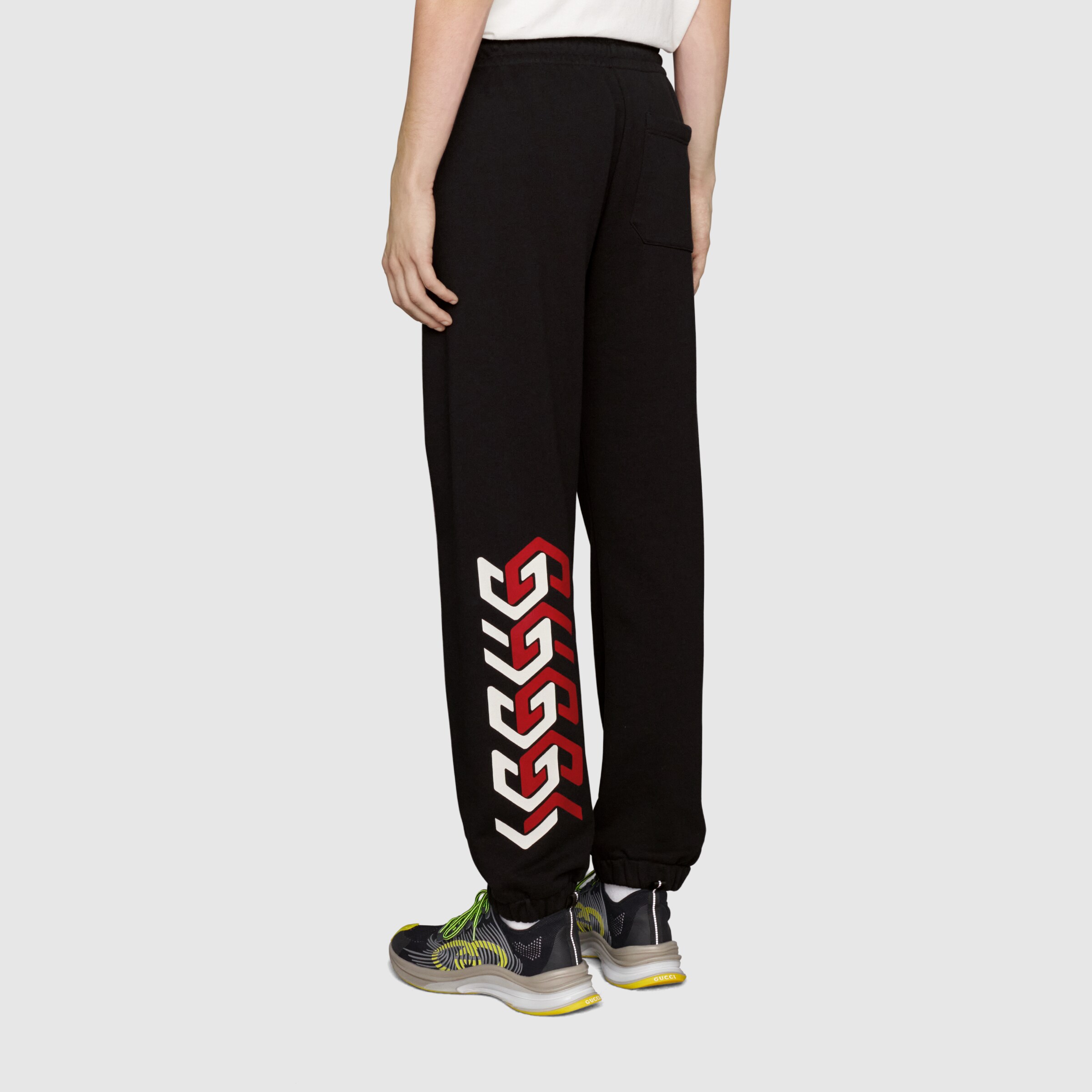 681145_XJDV3_1152_005_100_0000_Light-Jersey-track-bottoms-with-Gucci-mirror-print.jpg