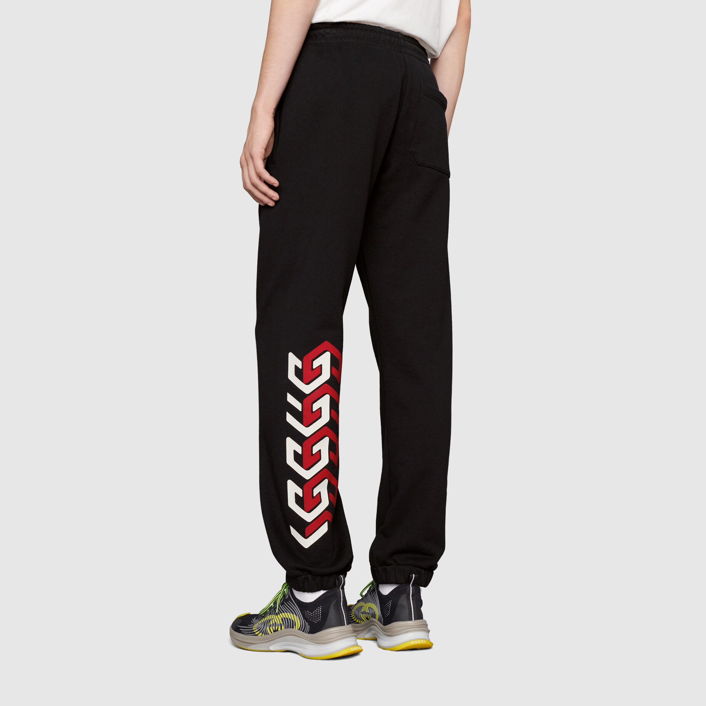 681145_XJDV3_1152_010_100_0000_Light-Jersey-track-bottoms-with-Gucci-mirror-print.jpg