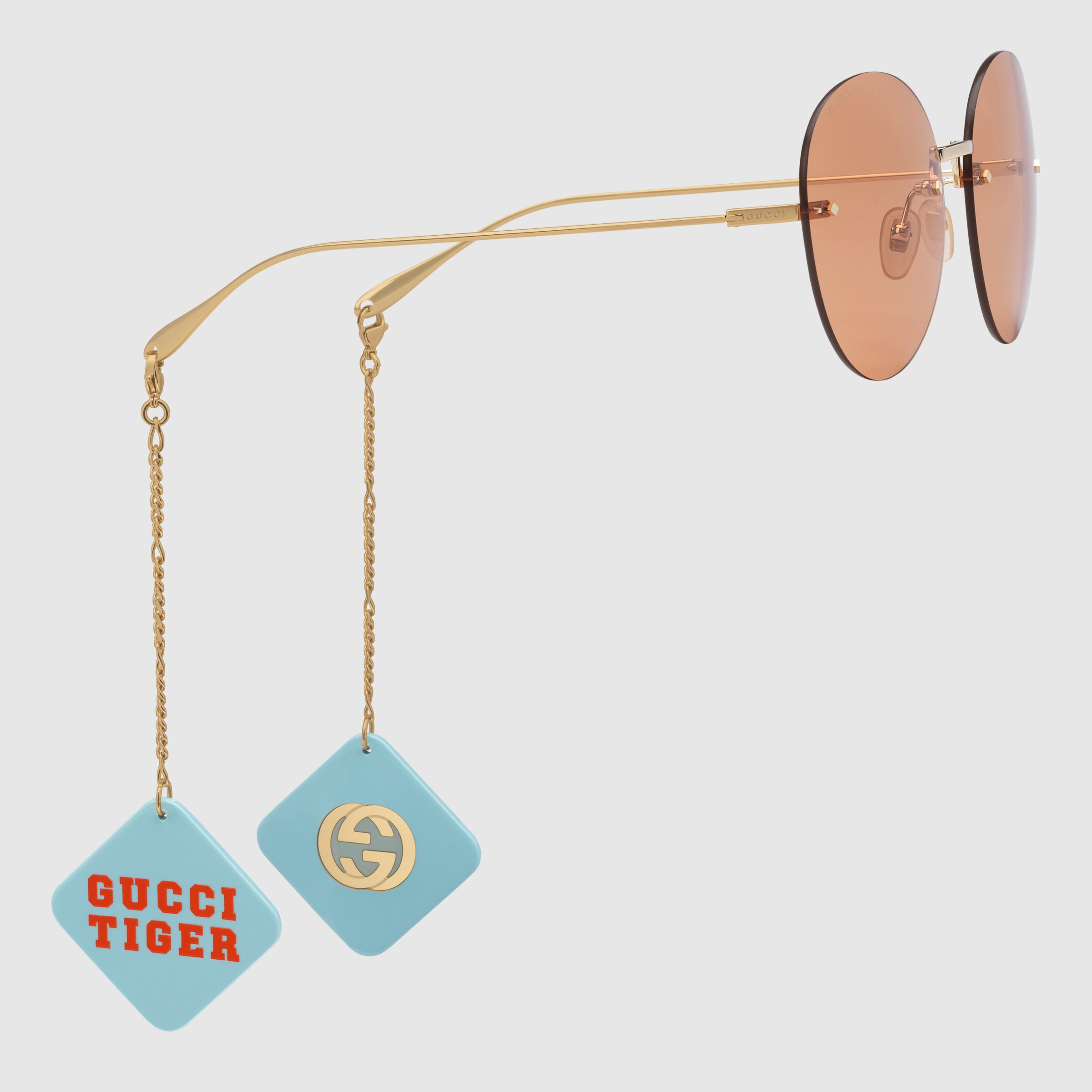 690989_I3330_8075_003_100_0000_Light-Gucci-Tiger-round-frame-sunglasses-with-pendant.jpg