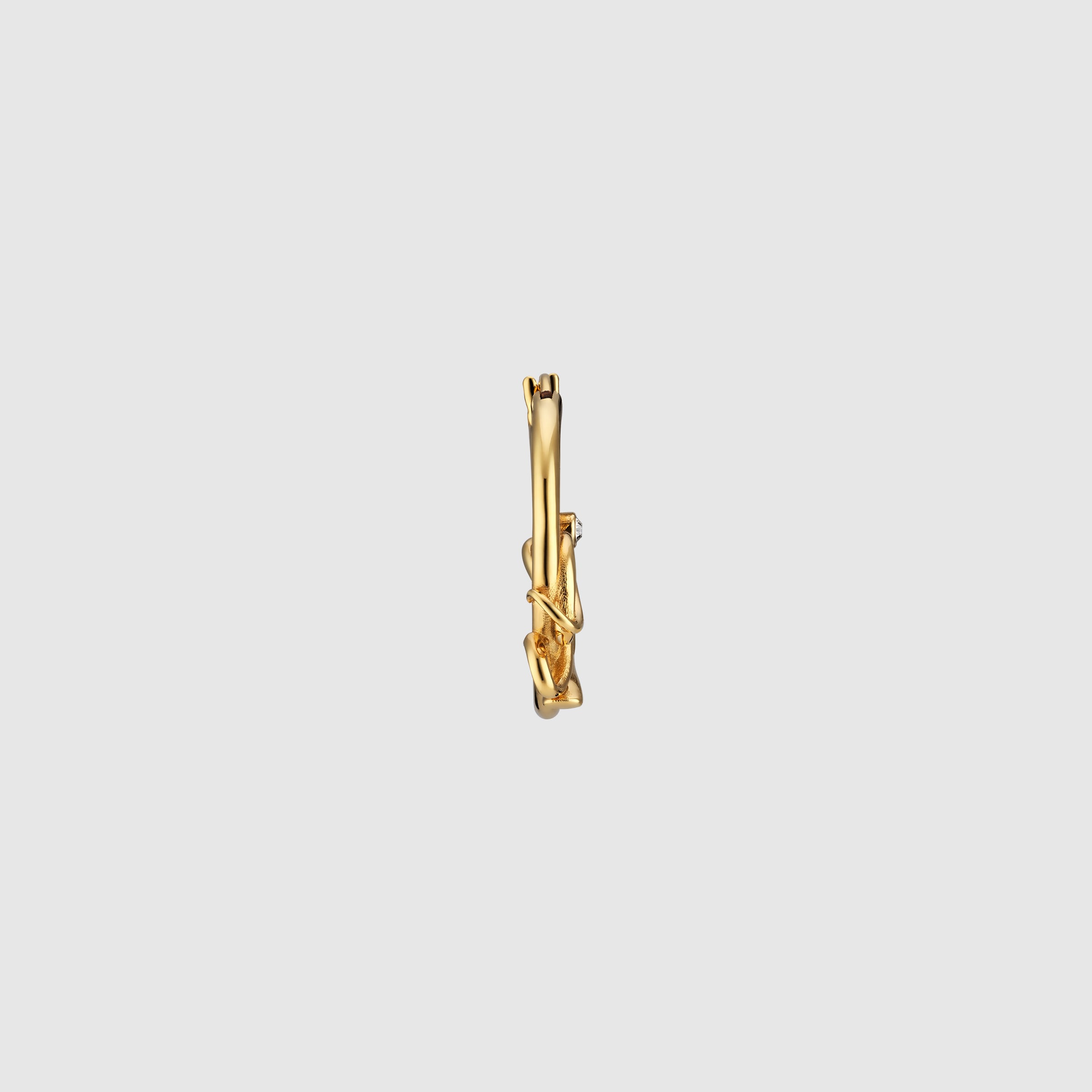 Hoop earrings with Gucci script in yellow gold-toned metal