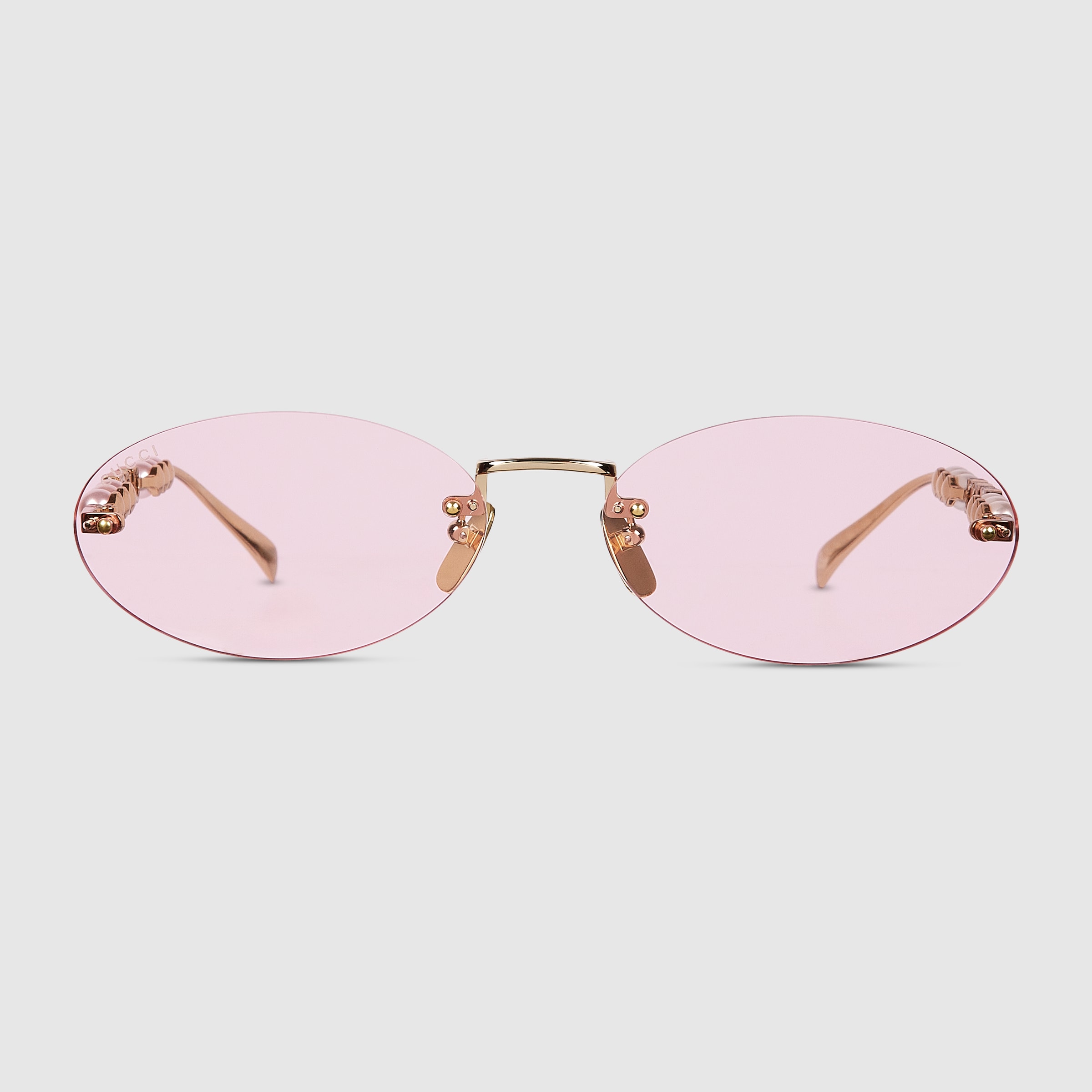 サングラス GUCCI Gold oval sunglasses Logo embellished oval sunglasses in gold - Gucci | Mytheresa