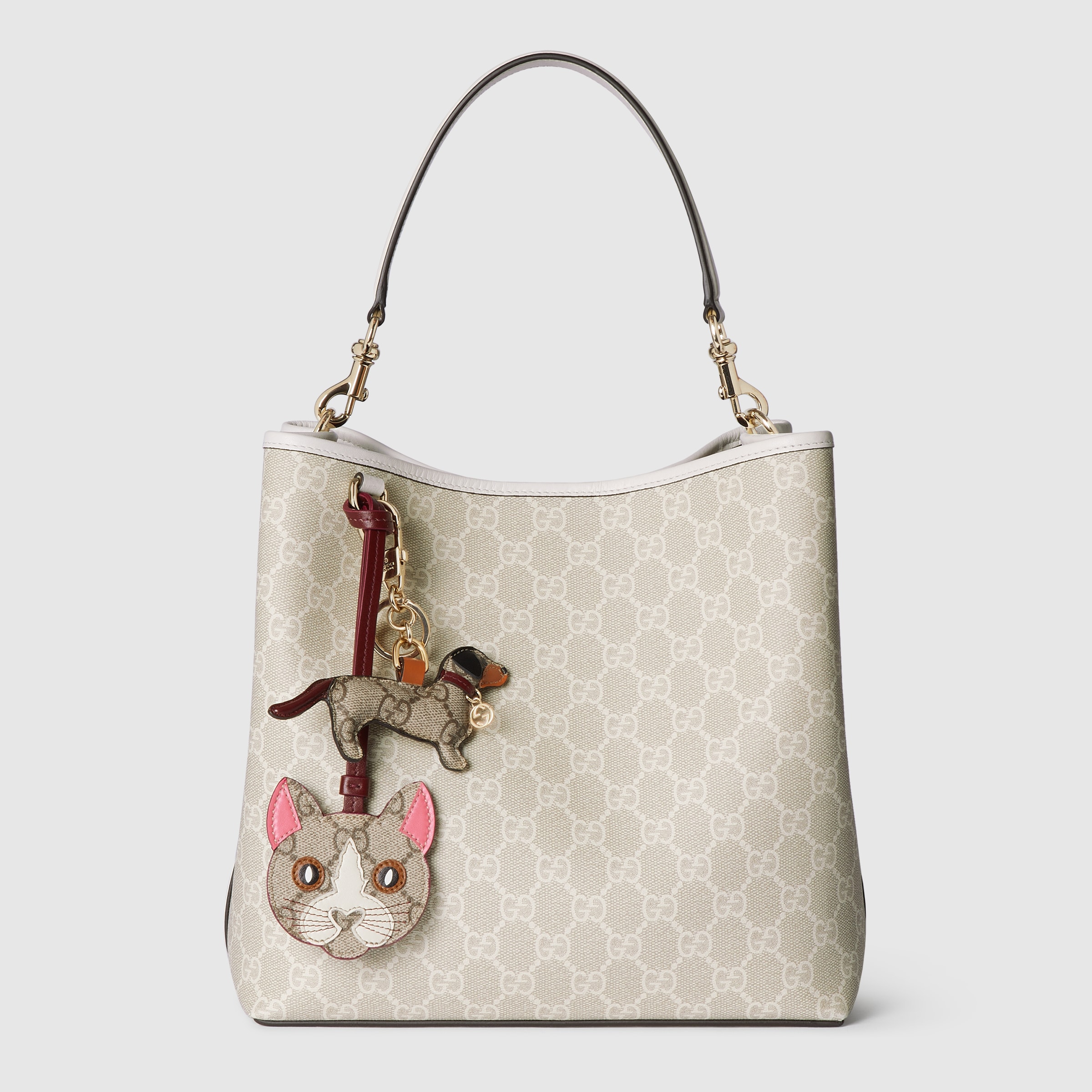 GUCCI 26S GG EMBLEM BUCKET BAG 25 IN LIGHT PINK COATED FABRIC