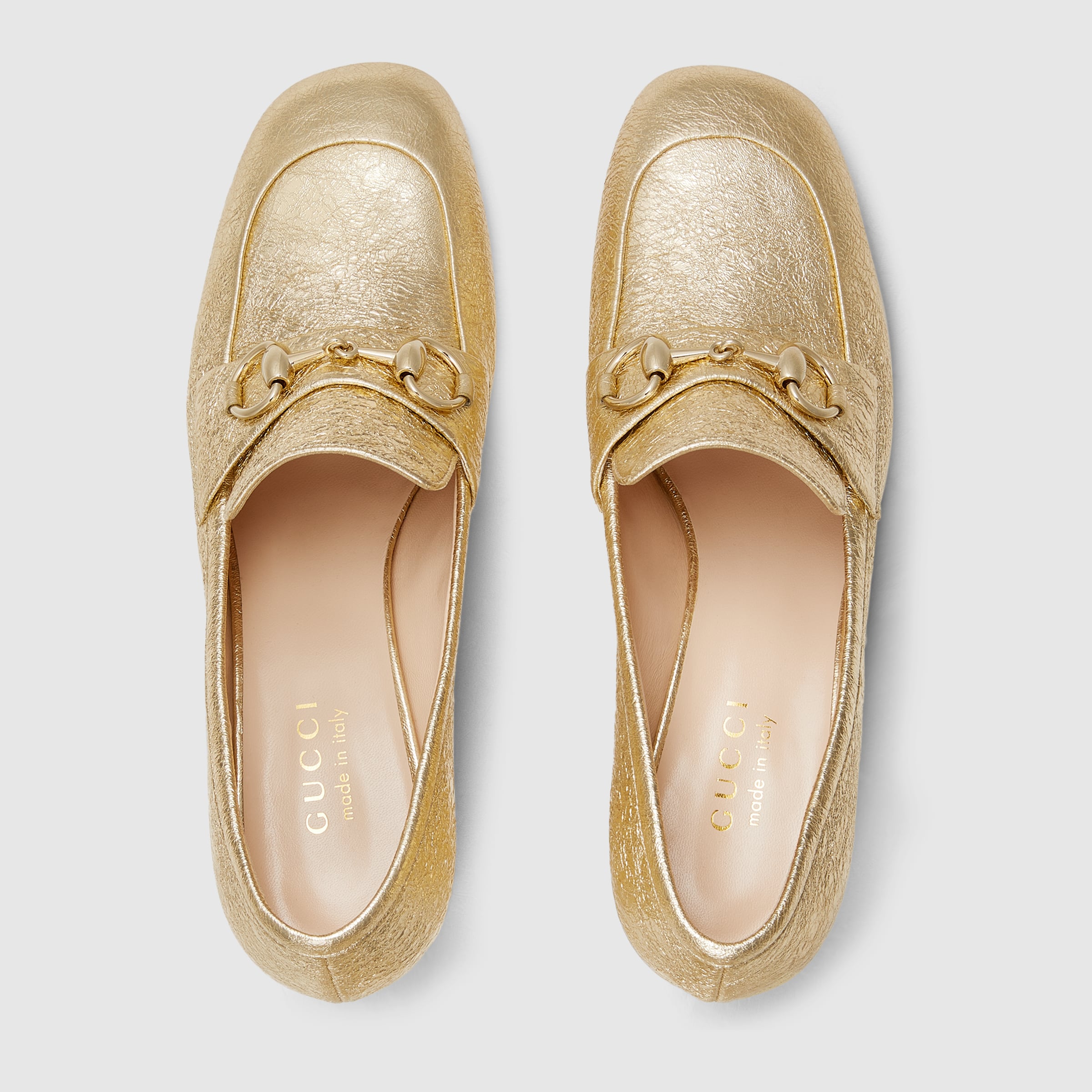 Women's loafer pump with Horsebit in golden metallic leather