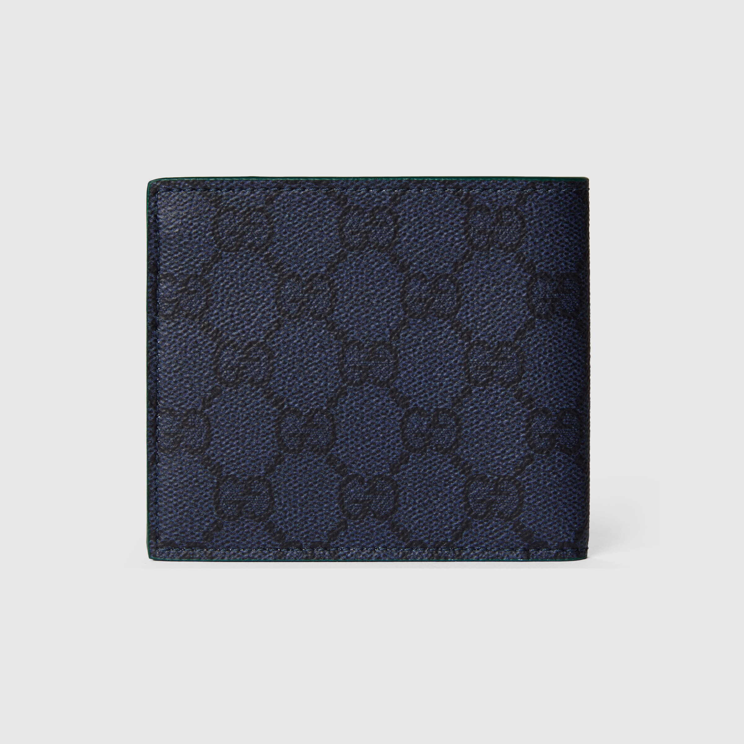 Green interior GG bi-fold wallet in dark blue GG Supreme | GUCCI® US