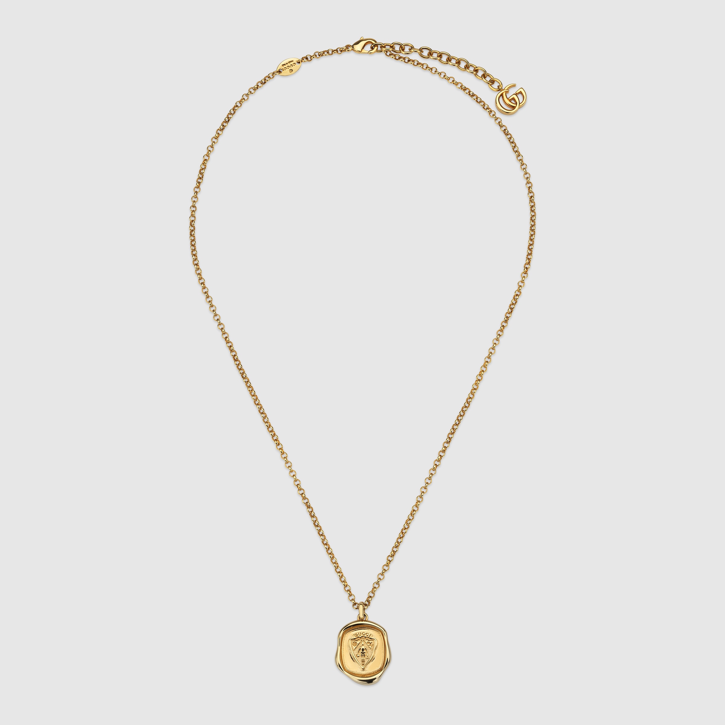 Gucci crest pendant necklace in gold-toned brass | GUCCI® UK