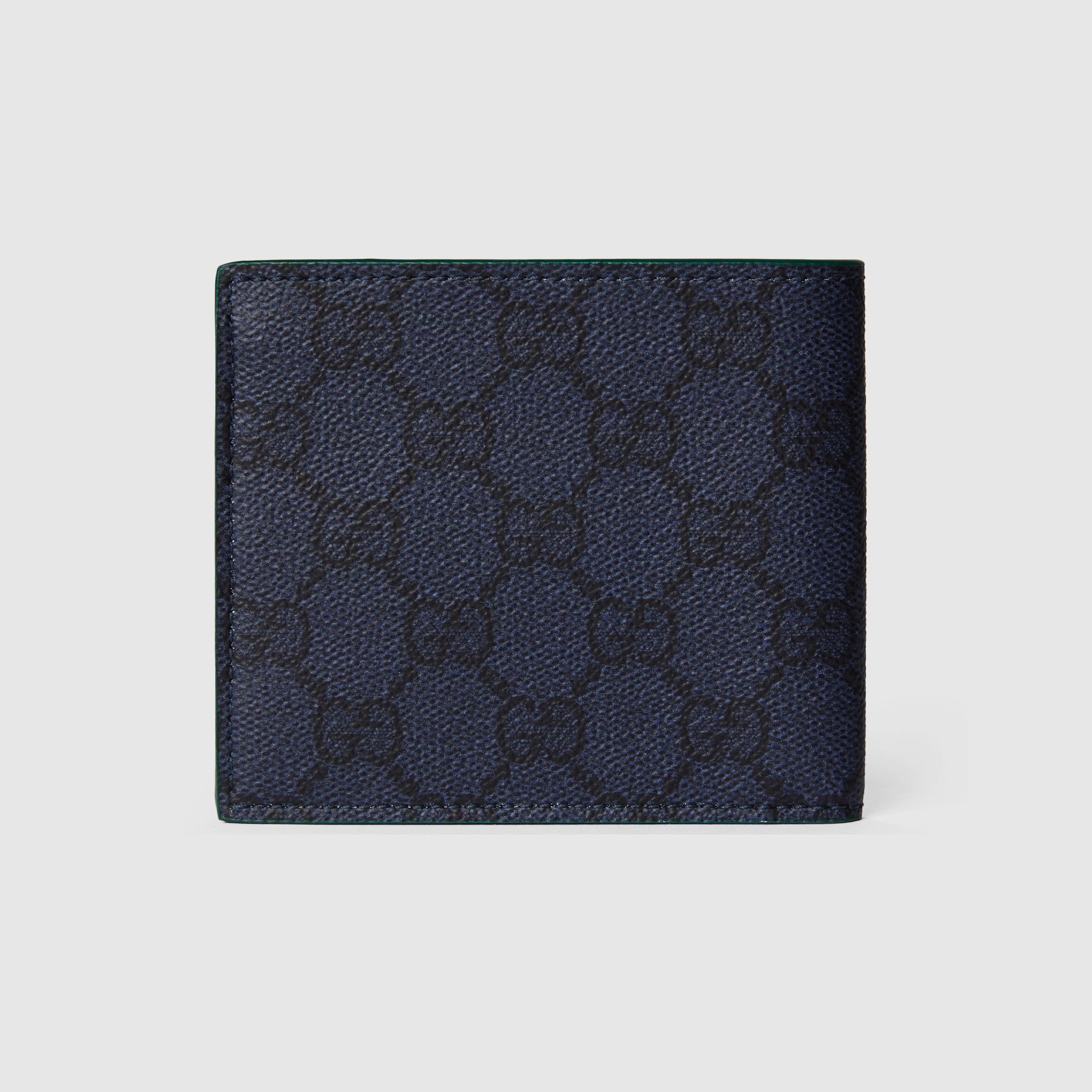 Green interior GG bi-fold wallet in dark blue GG Supreme | GUCCI® US