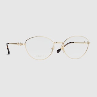 Round optical frame in gold toned metal GUCCI US