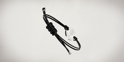 Gucci crest leather cord bracelet with charm