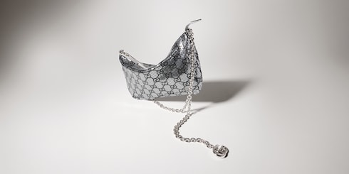 Metallic evening bag with charm