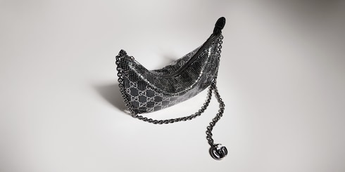 Metallic evening bag with charm