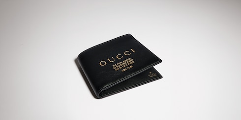Bi-fold wallet with gold-foiled logo