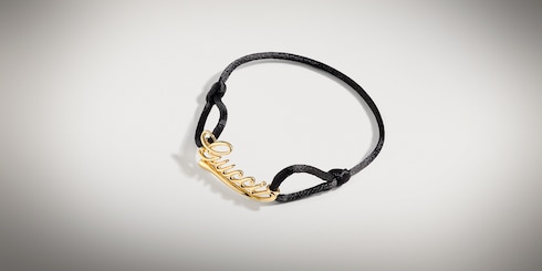 Gucci Schriftzug Kordelarmband