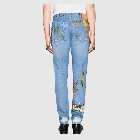 Embroidered denim trousers in light blue denim GUCCI NO