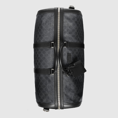 Soft GG Supreme carry-on duffle in Black/grey soft GG Supreme, crafted from a coated microfiber 