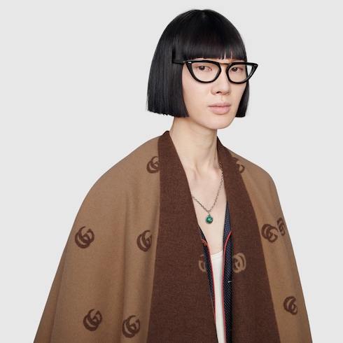Reversible cape with Double G pattern