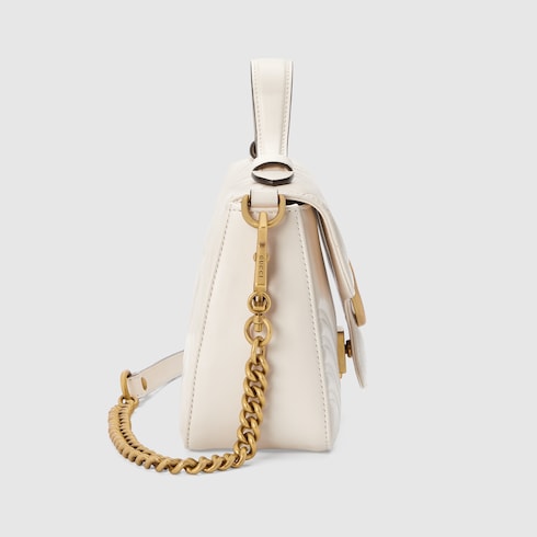 White gucci purse with best sale gold chain