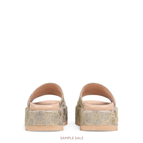 brown and gold gucci slides