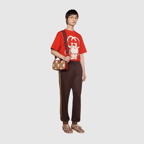 Doraemon x Gucci small crossbody bag in mini GG canvas GUCCI