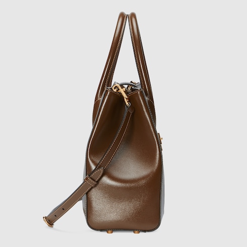 Medium tote bag with piston closure